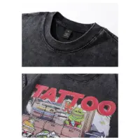 Чорна бавовняна футболка «TATTOO PEPE» із принтом персонажа Pepe у стилі майстра татуювань, вільного крою.