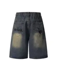Джинсові шорти «NODOK» із washed-ефектом та графічним принтом павука і павутини у стилі streetwear.
