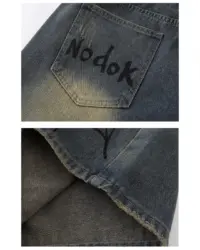 Джинсові шорти «NODOK» із washed-ефектом та графічним принтом павука і павутини у стилі streetwear.